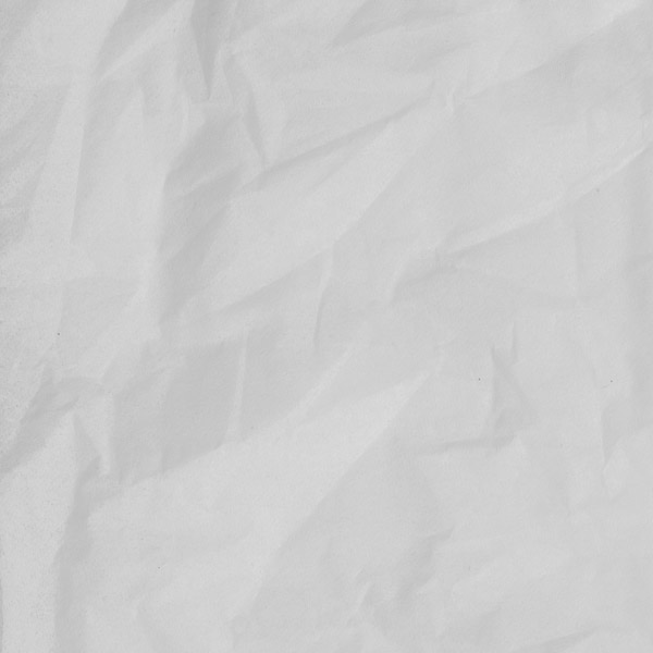 Fotografia em zoom de um papel amassado.